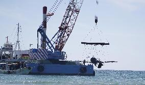 Japanese World War II fighter salvaged from sea