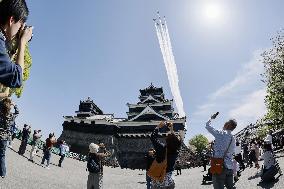Blue Impulse aerobatic team flies over Kumamoto