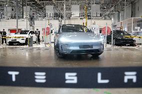 Tesla unveils Shanghai factory to media