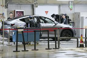 Tesla unveils Shanghai factory to media