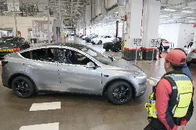 Tesla unveils Shanghai factory to media