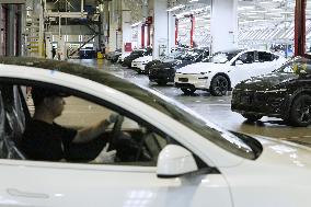 Tesla unveils Shanghai factory to media