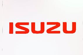 Isuzu Motors logo and sign