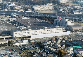 Exterior view of the Daihatsu Headquarters Plant, logo, and sign