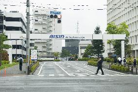 Aisin's exterior, logo, and sign