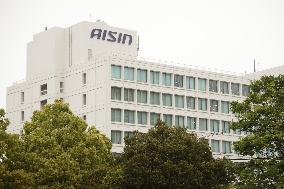 Aisin's exterior, logo, and sign