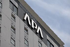 APA Hotel signboard and logo
