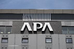 APA Hotel signboard and logo
