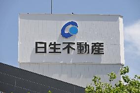 Nissei Real Estate signboard and logo