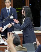 Hearing-impaired lawmaker at Japan parliament session