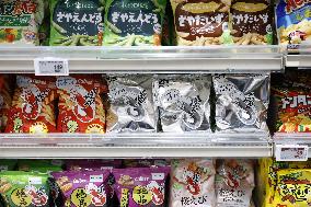Black-and-white Calbee snack packages