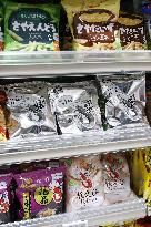 Black-and-white Calbee snack packages