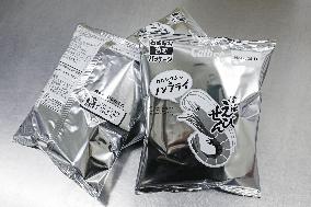 Black-and-white Calbee snack packages