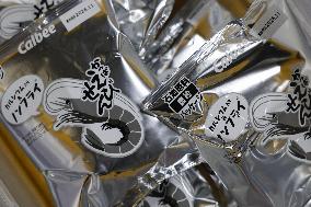 Black-and-white Calbee snack packages