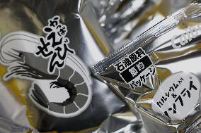 Black-and-white Calbee snack packages