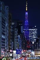 Tokyo Tower lit up in blue