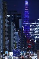 Tokyo Tower lit up in blue