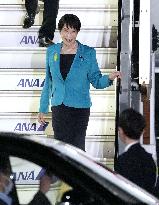 Japan PM returns home