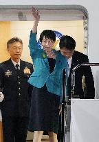 Japan PM returns home