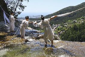 Sacred rope exchange at Nachi Falls