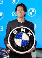 Football player Nakamura pitches BMW new EV