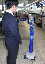 Passenger-assisting avatar robot at Hiroshima airport