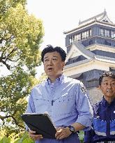 Japan top spokesman visits quake-hit Kumamoto