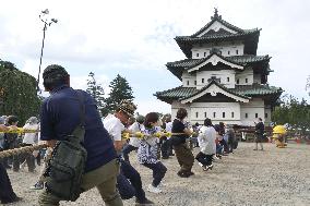 Hirosaki Castle keep moved to original location