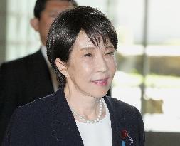 Japan PM Takaichi returns home